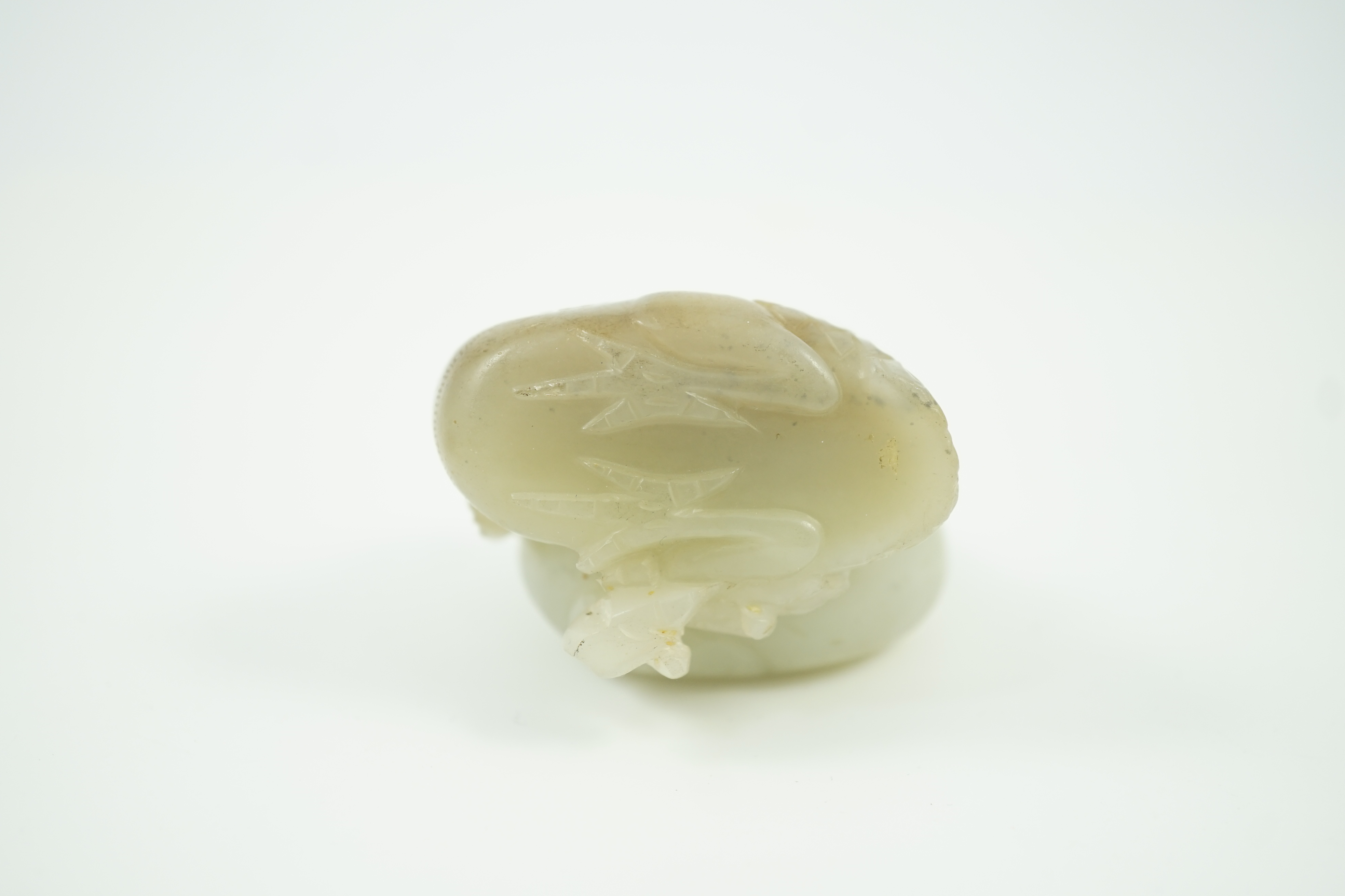 A Chinese pale celadon jade chicken group, 19th century, small faults